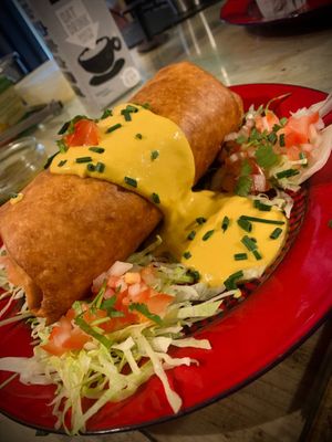 Chimichanga covered in our nacho cheeez sauce  at Tacos and Flipflops - Pop-up in Peterborough