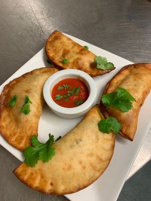 Empanadas stuffed with Tacos and Flipflops mock mheats, their Cheeze sauce and jalapeños.  at Tacos and Flipflops - Pop-up in Peterborough