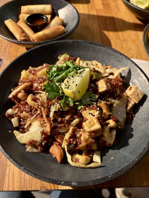 Brown rice (no egg option), tofu, shiitake, pineapple, cashews and veggies in sweet and sour sauce with a side of veg spring rolls  at Wok On in Copenhagen