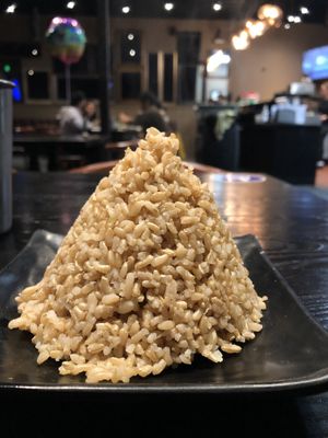 Side of brown rice for the stir fry. Arrived in this cone shape  at Buddha Thai Bistro in Vacaville
