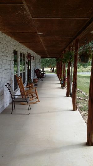 Enjoy your morning Joe or a glass of vino on our breezy front porch overlooking our lake. at Nickeys' Nest in Paris