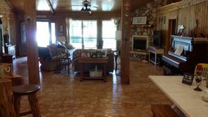 Here is our "lodge" living room.  2 story ceiling, fireplace and looks out on our lake. at Nickeys' Nest in Paris