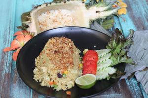 this absolutely tastes beautiful. Juicy Pineapple baked rice.  It has crispy onions in a sumptious pineapple rice bed. Addictive! at HOME Kitchen, Bar & Bed in Phuket