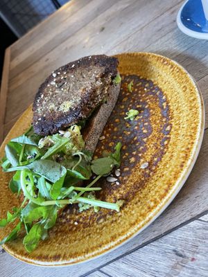 Avocado on toast with a vegan sausage patty   at All the Shapes in Prestwich