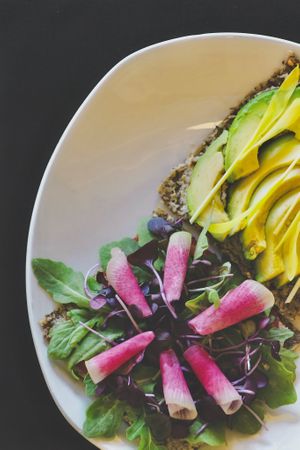 Avocado Sammie: Raw sprouted onion bread, avocados, sprouts, herb paté, watermelon radish, lettuce and love.  at Giving Tree Cafe in Phoenix