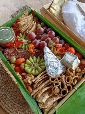 Cheese board with fruits, nuts and vegan ham. at TreeNut Cheezery in Ubud