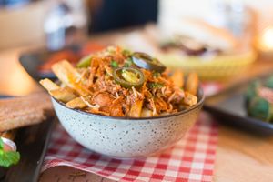 Loaded fries with vegan cheese sauce, jackfruit and jalapeños  at Mockingbird in Wellington