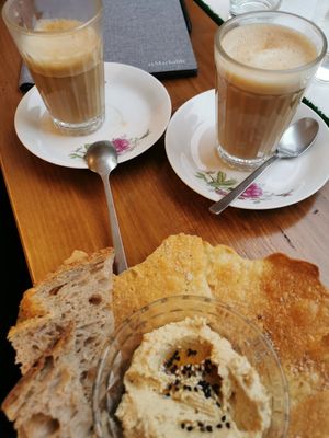 Oatly Coffee and hummus! at Tiffin Cafe in Lisbon