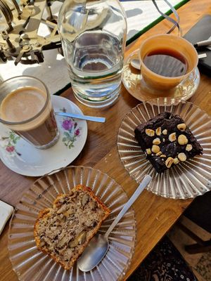Mocha coffee with oat milk, banana bread, vegan brownie at Tiffin Cafe in Lisbon