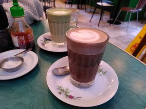Hot chocolate and matcha latte at Tiffin Cafe in Lisbon