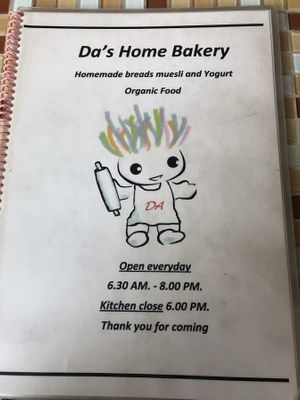 Menu front with hours at Da's Home Bakery in Chiang Mai