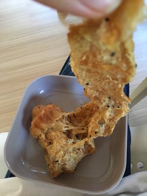 After a trip in the microwave - layered doughy “buttery” goodness. The sprinkle of sesame seeds added some nice texture too! at Da's Home Bakery in Chiang Mai