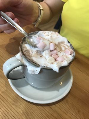 Chai latte with cream and marshmallows   at Green Olive in Menai Bridge