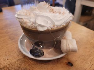 Hot Chocolate with Cream and Marshmallows at Green Olive in Menai Bridge