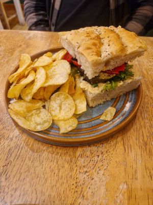 Hummus and med veg sandwich with salted crisps at Green Olive in Menai Bridge