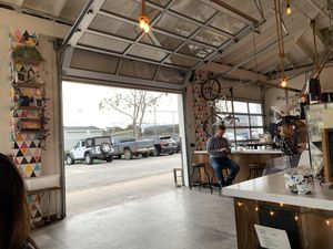 Inside of cafe looking out at the parking lot  at Captain + Stoker in Monterey