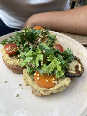 sourdough bread with hummus, salad and roasted veggies  at Manna Porto in Porto