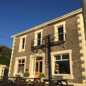 Patio waterfront dining at Careys Bay Historic Hotel in Dunedin