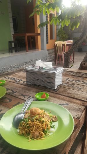 enjoying food on the terrace at Warung Vegetarian in 