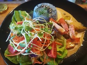 grilled veggies served with streamed coconut rice with blue flowers, mixed salad and paneng curry sauce at Street Vegan House in Koh Phangan