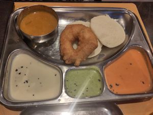 Idli + vada and a variety of chutneys and sambar at Krishna Vilas in Utrecht