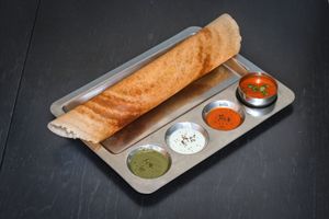 Masala Dosa - Thin and crispy rice and lentil pancake, filled with
potato and onion masala, served with tiffin sambar
and varieties of chutney at Krishna Vilas in Utrecht