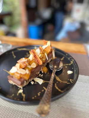 Our pastry chef's specialt
Chocolate Lover Dessert, Vegan, GF, & besides the crunchy caramel on top, no sugar: Dates/Pecans/Belgian Dark Chocolate/Coconut Butter/Pineapple Framboi at Piazza 1909 in La Jolla