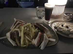 Vegan club sandwich and aubergine salad dish with almond milk Irish coffee  at Cafe12 in Crete