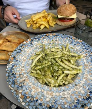 Vegan burger, pasta with pesto and greek dumplings filled with herbs  at Cafe12 in Crete