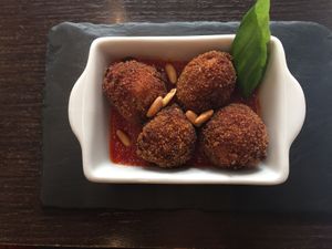 Vegan meatballs on tomato sauce at Arte de Tapas in Antequera