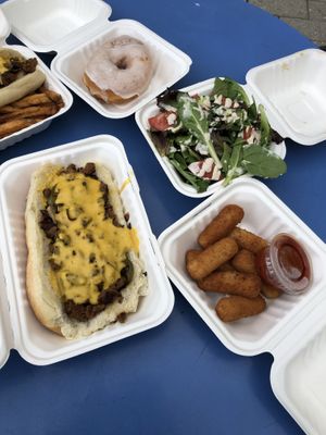 Philly cheesesteak, side salad, glazed donut and mozzarella sticks. at Angelhearts Donuts in Ithaca