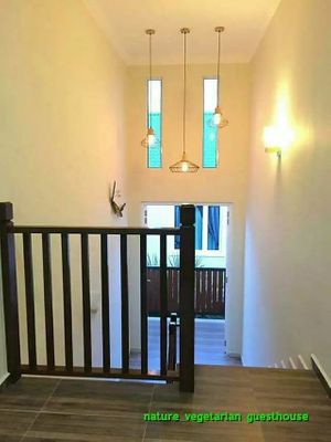 staircase to family suite at Nature Vegetarian Guest House in Malacca