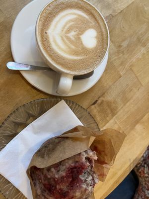 Pea milk cappuccino and banana raspberry coconut muffin  at Kawa in Poznan