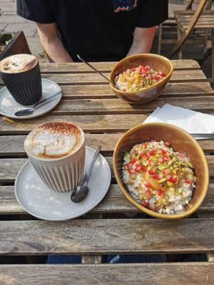 Two sweet tahini, pistachio and apricot overnight oats and two oat milk cappuccino (one decaf). All very good! at T @ the dials in Brighton