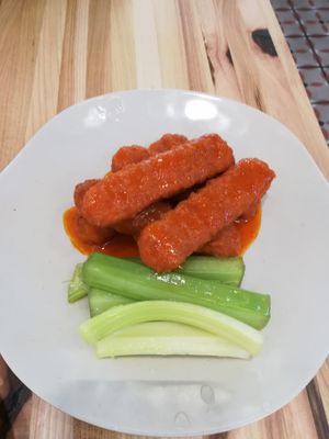 Spicy Wings with celery at Veggie Grill by Next Level in Cambridge