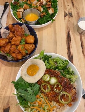 Crispy cauliflower, All hail Kale salad with vegan chikn added on top, Far east thai chikn bowl with vegan egg on side.  at Veggie Grill by Next Level in Cambridge