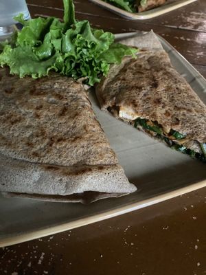 My huge roll: buckwheat crepes filled with hummus, tomato sauce, spinach, grilled oyster mushrooms, grilled aubergines and grilled tofu! at French Creperie and Bar in Kathmandu