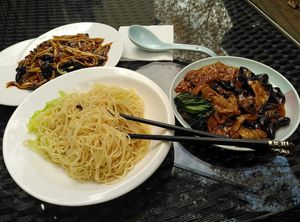 Noodles with spicy beancurd and mushrooms  at GōngDé Lín - Godly - Huanghe Rd in Shanghai