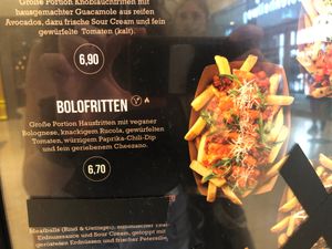 Option 1 - Bolofritten: big portion of fries with vegan bolognese sauce, arugula, diced tomatoes, bell pepper-chili dip and grated Cheezano at Frittenwerk - Westenhellweg in Dortmund
