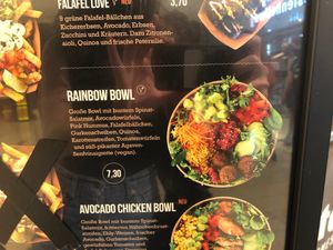 Option 2 - Rainbow bowl: big bowl with mixed salad and spinach leaves, diced avocado, pink hummus, falafel balls, cucumber slices, quinoa, grated carrots, diced tomatoes  at Frittenwerk - Westenhellweg in Dortmund