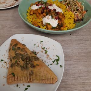 The lentil samosa and the chickpea madras curry in the background at Simple Goodness in Penrith