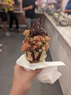 Vanilla and matcha swirl with chocolate hardshell and strawberry cheesecake crumbles at Big Softie in Atlanta