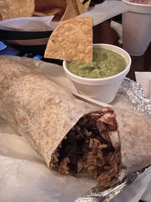 Vegan burrito w/ sriracha cauliflower, chips & guac   at Xtreme Tacos in Tampa