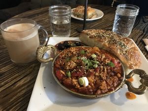 Pistachio latte, mememen, and spinach cheese borek in the back  at The Baklava Lady in English Town