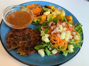 Veggie pattie lunch, with salad, plantain and pebre sauce. at Fresh Fusion in San Pedro Sula
