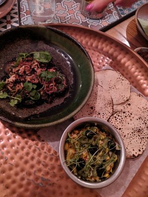Chilli fried aubergine with sides  at Thali in Cape Town