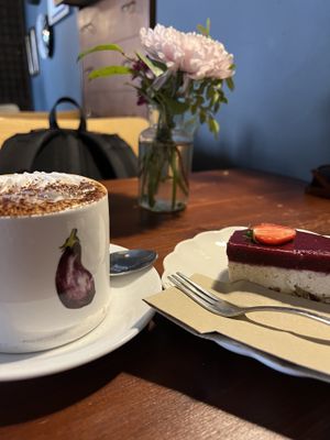 Cappuccino with cream and cheesecakee  at Greens & Co in Galway