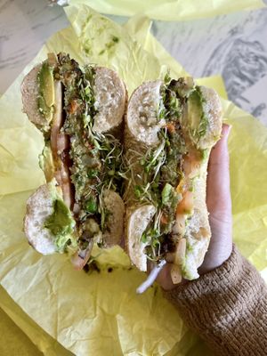 Vegan bagel sandwich with regular tomatoes instead of sundried   at Bagel Kitchen in Pacific Grove