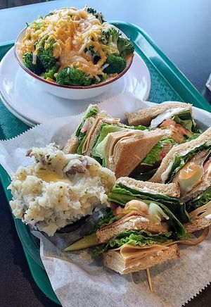 Famous turkey club with a side of smashed potatoes and a potato broccoli cheese bowl. at eden in Wilkes-barre
