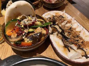 Burger and veggies in steamed bun + rice cakes  at Vegan House - Alaunstraße in Dresden